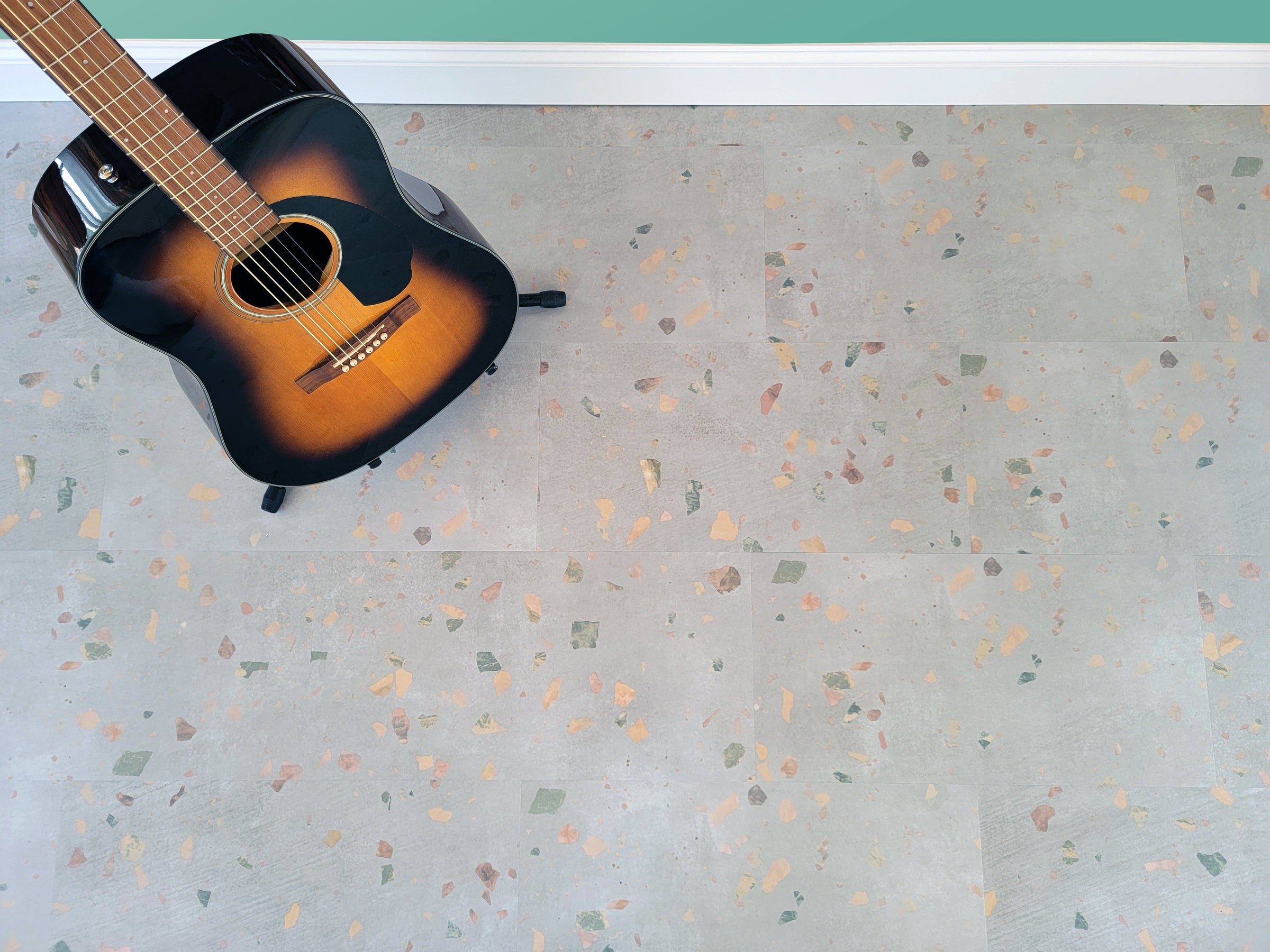 Terrazzo vinyl floors with a guitar on a stand