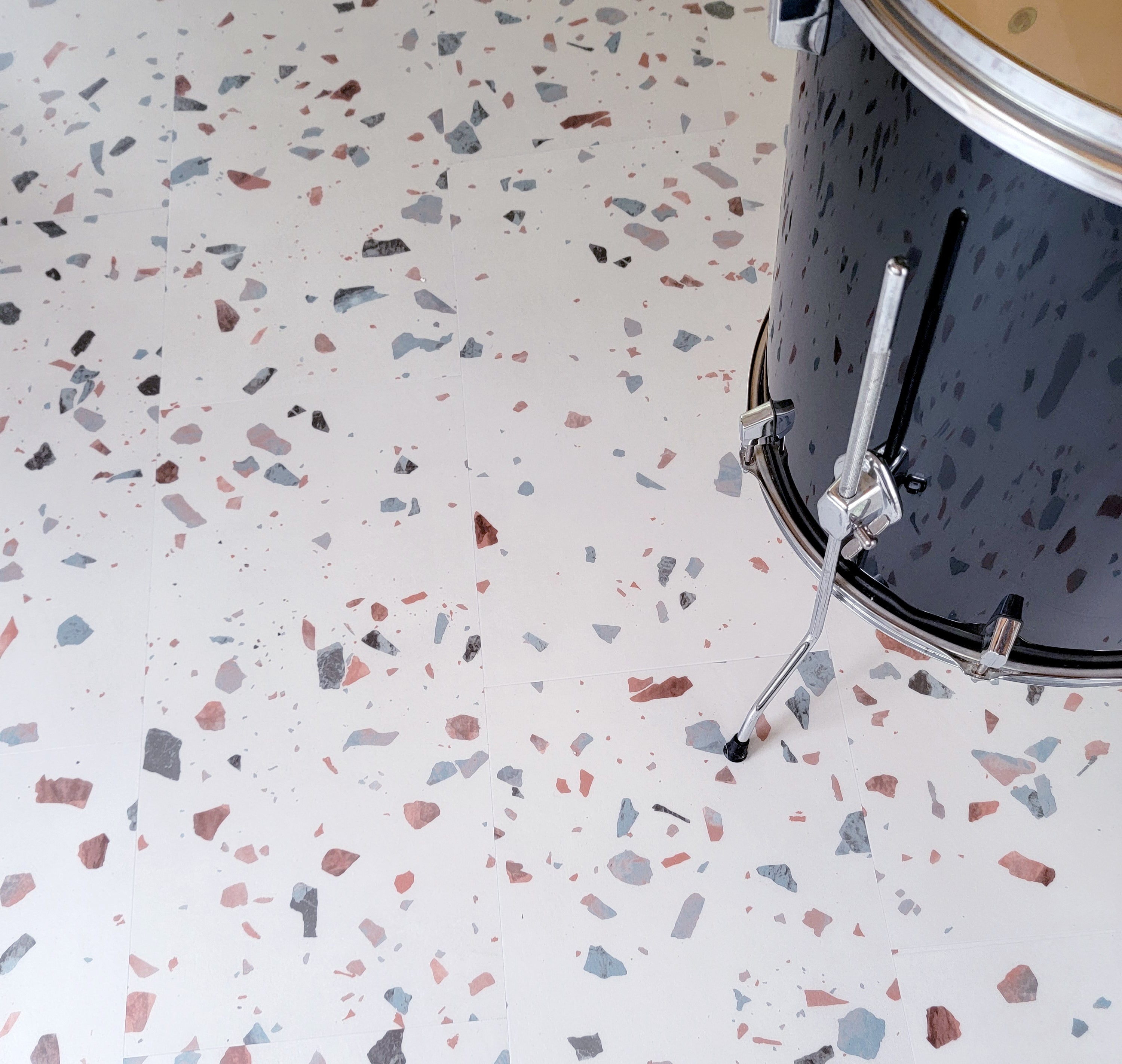 Terrazzo luxury vinyl tile with drum