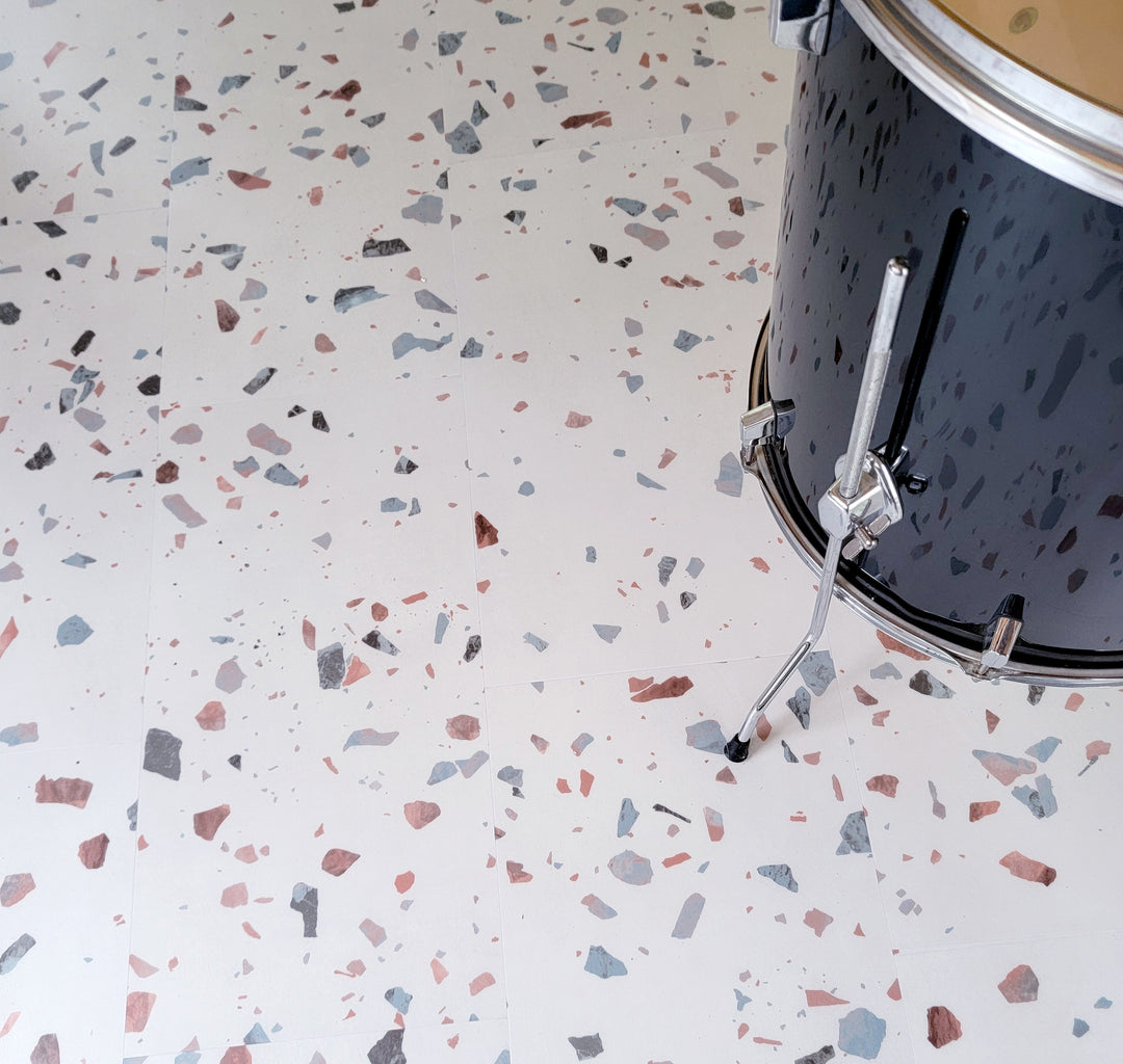 Earl Grey terrazzo vinyl tiles with black floor drum