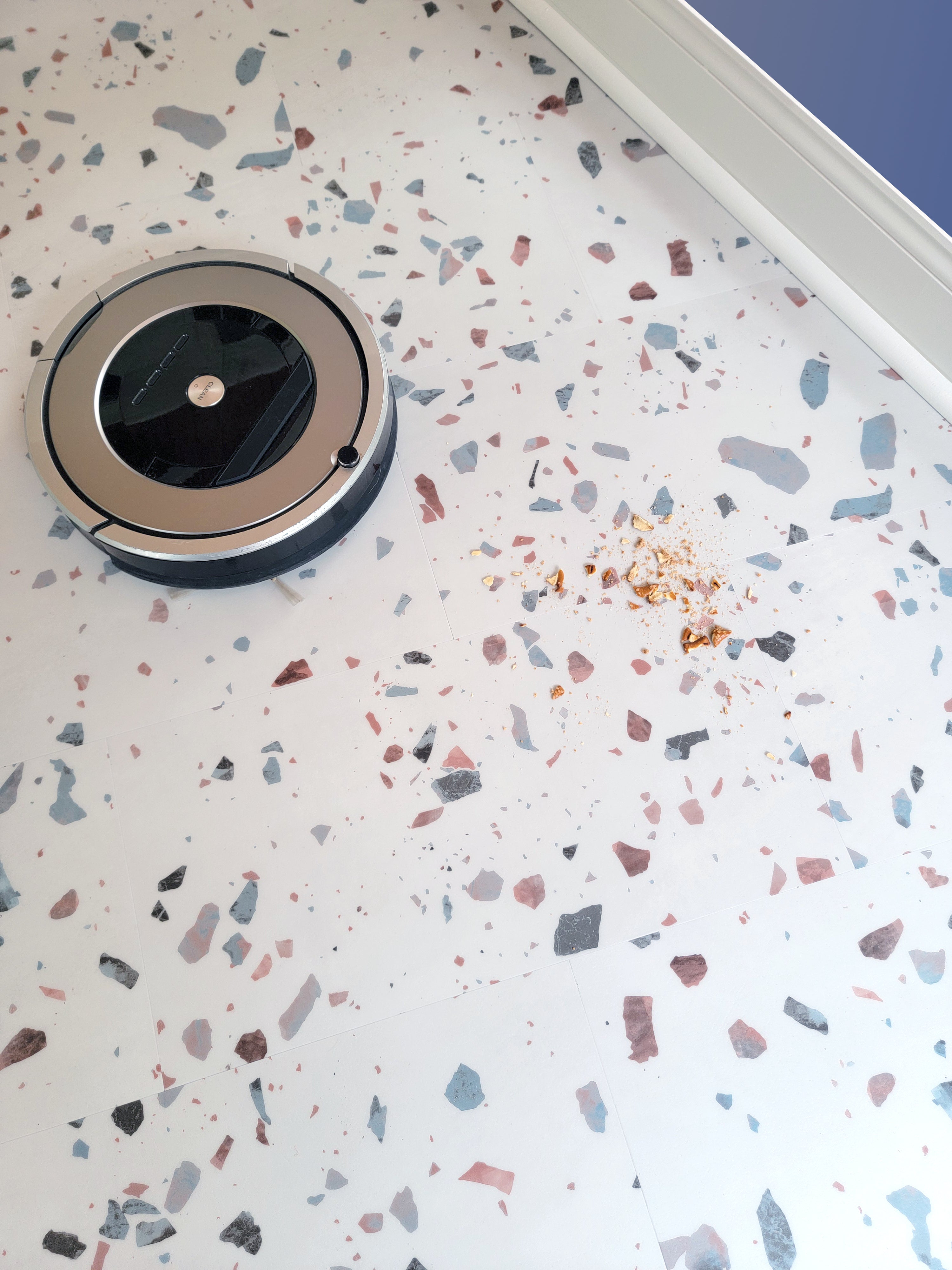 Terrazzo floor with robot vacuum cleaning up