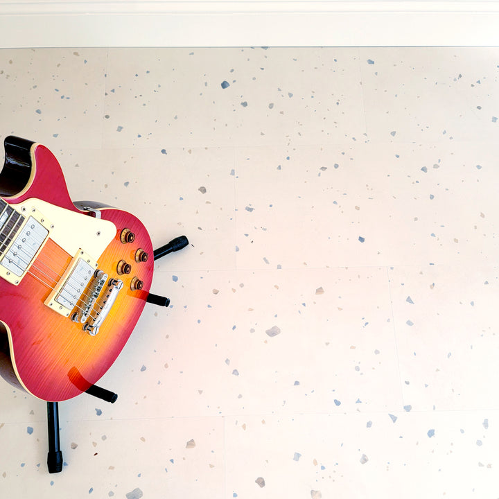 perfect parfait terrazzo vinyl floor with sunburst electric guitar on stand