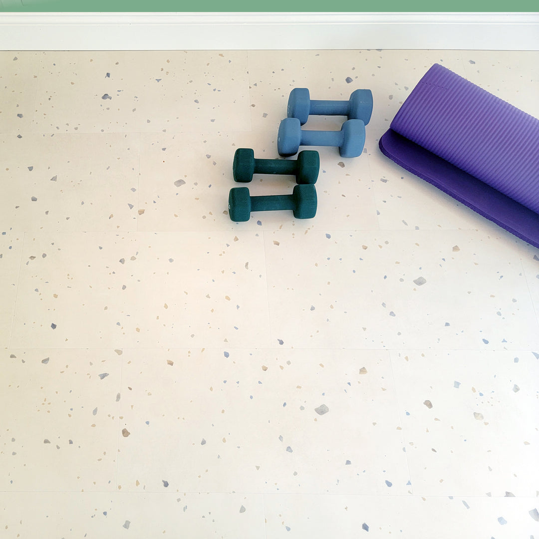 Perfect parfait terrazzo vinyl tiles with exercise weights and yoga mat