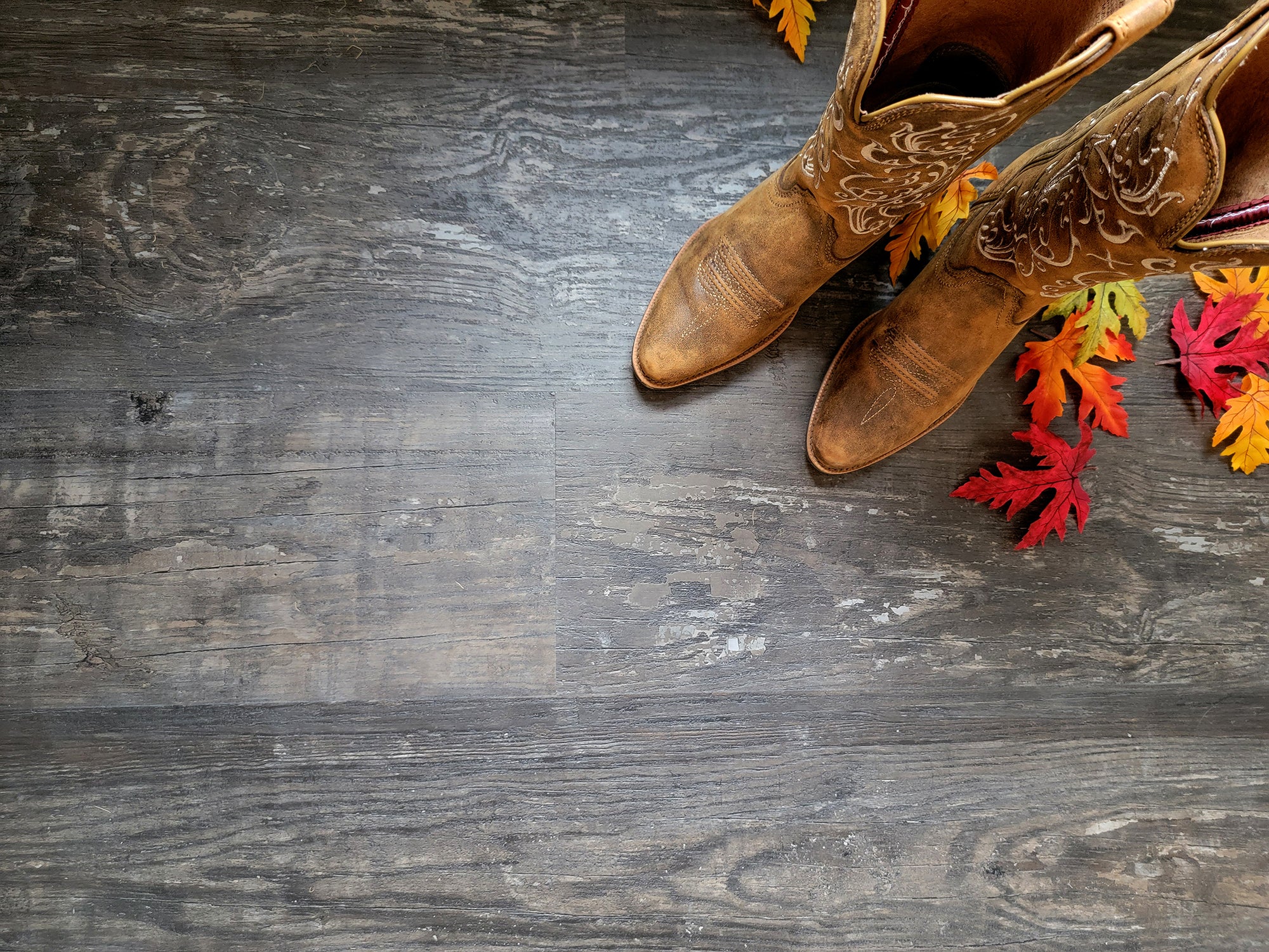 Unique rustic LVP with boots and fall leaves