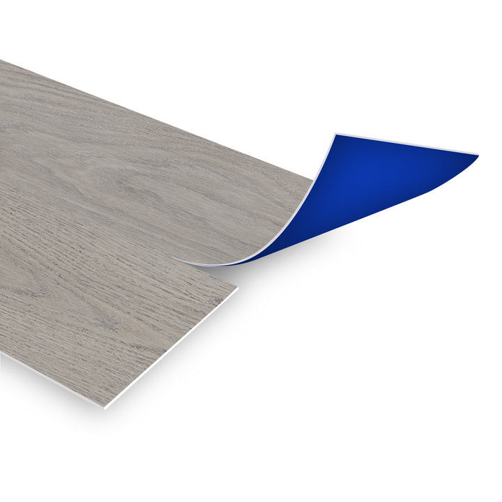 Allure Heavenly Mountain Peel & Stick vinyl flooring planks viewed at an angle to see the blue adhesive backing