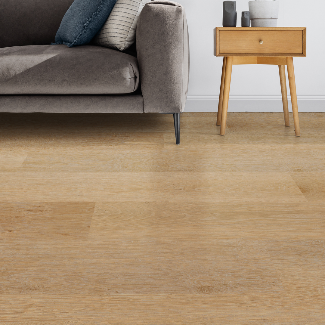 Allure honey butter oak plank flooring in a room with sofa and end table with additional furnishings 