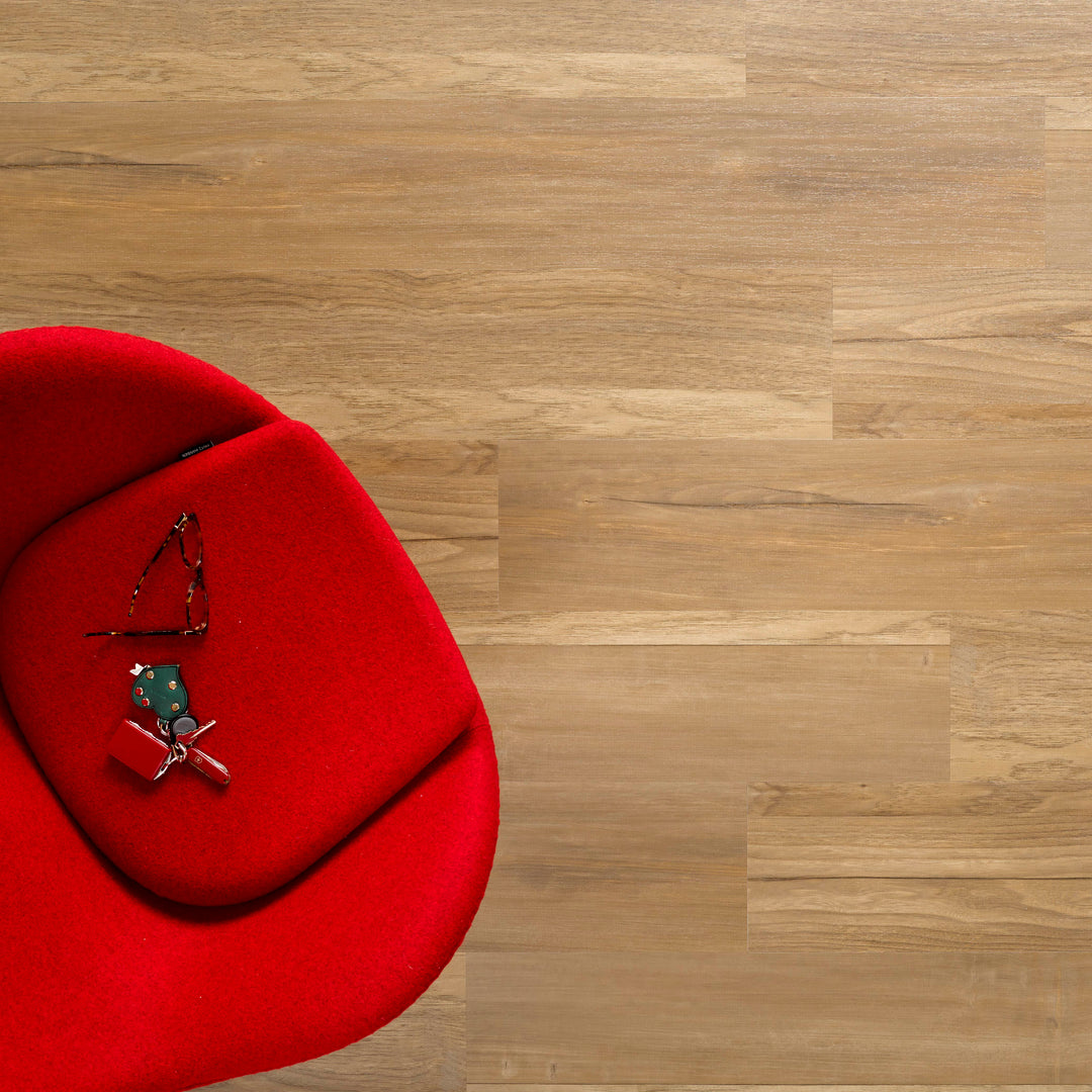 Allure SRP TPU Flooring in Mixed Timber Seawood installed floor view from above with a red chair