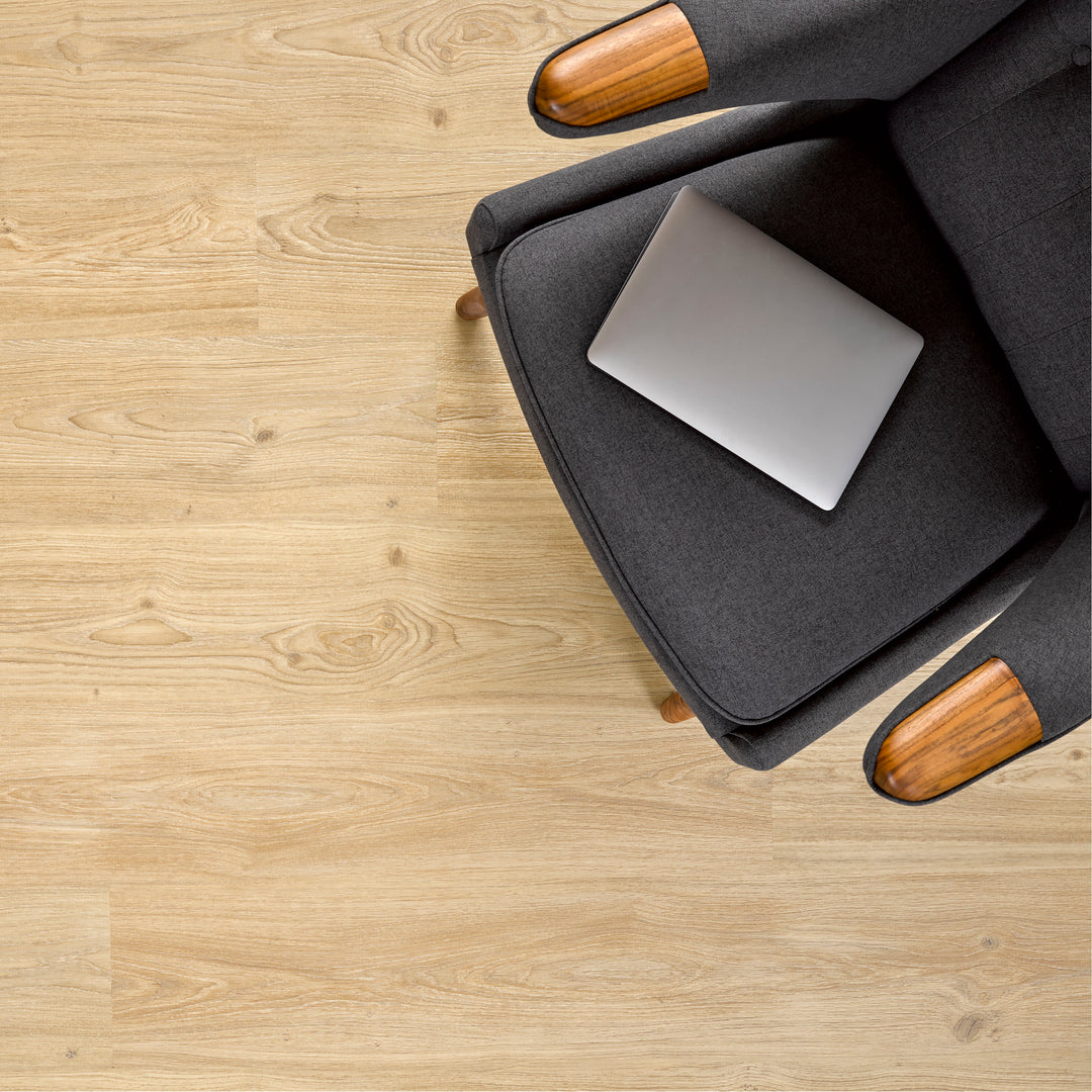Allure SRP TPU Flooring in Natural Oak Cinnamon installed floor view from above with grey chair