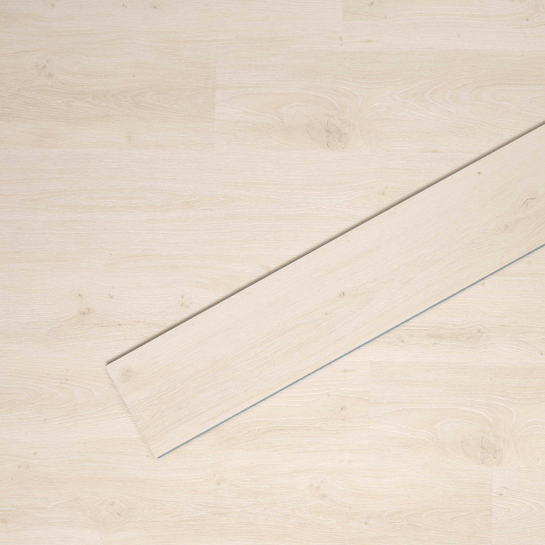 Allure SRP TPU Flooring in Soft Oak Chalk installed floor view from above with single plank laying on top
