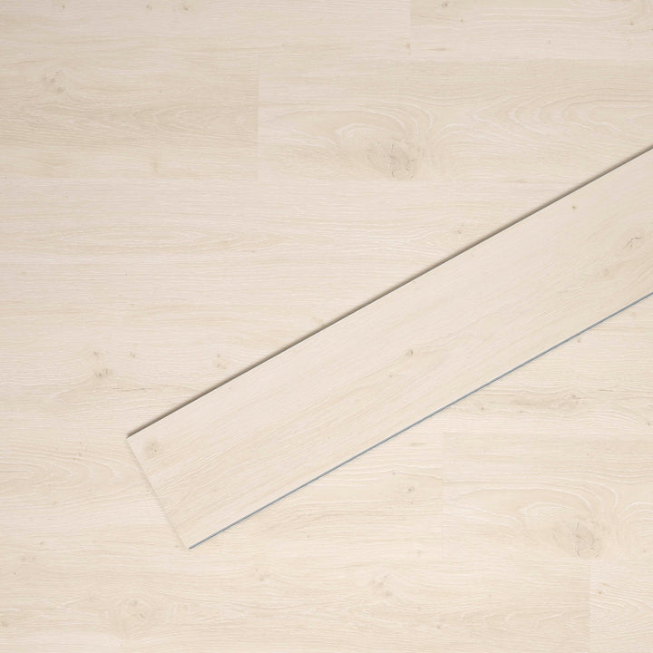 Allure SRP TPU Flooring in Soft Oak Chalk installed floor view from above with single plank laying on top