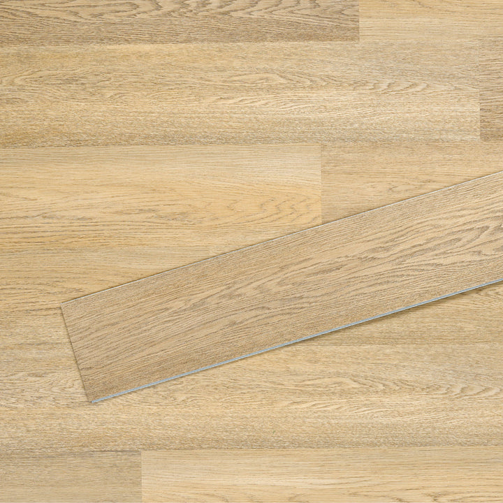 Allure SRP TPU Flooring in Pure Oak Sunrise installed floor view from above with single plank laying on top
