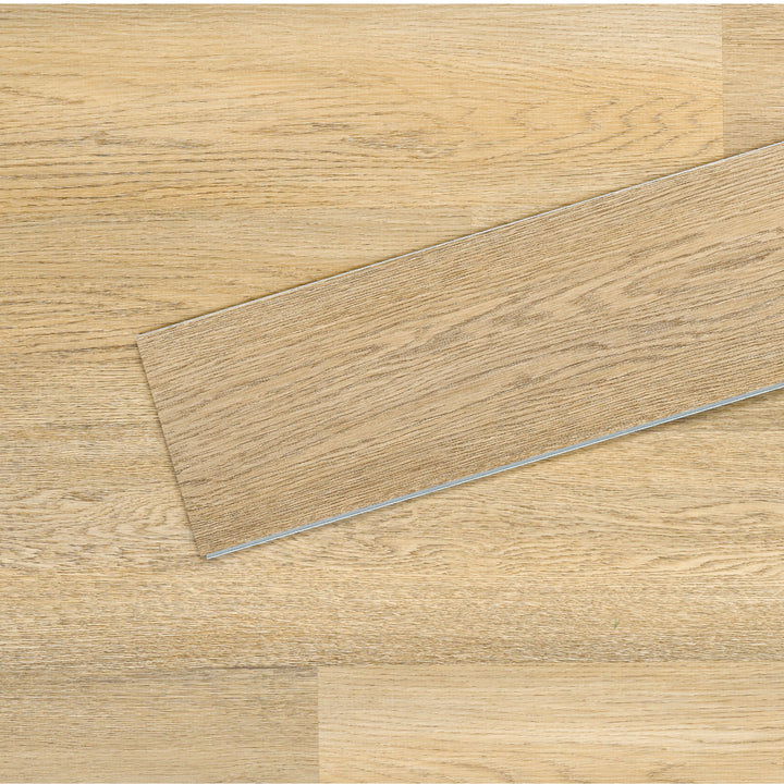 Allure SRP TPU Flooring in Pure Oak Sunrise installed floor view from above with close up of single plank laying on top showing grooves and edges