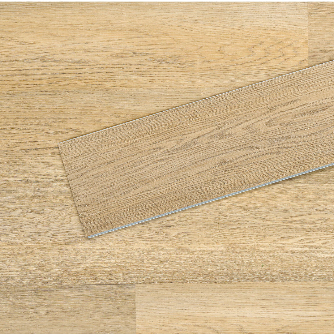 Allure SRP TPU Flooring in Pure Oak Sunrise installed floor view from above with close up of single plank laying on top showing grooves and edges